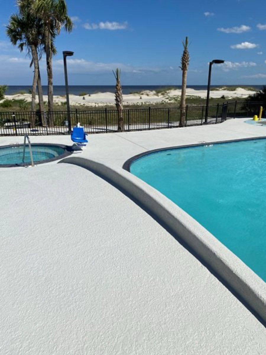 Decorative pool deck resurfacing project by Concrete Textures Inc.